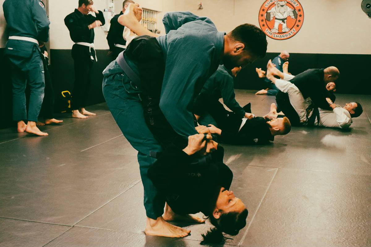 top self defense martial arts demonstrated in realistic street scenario with protective gear