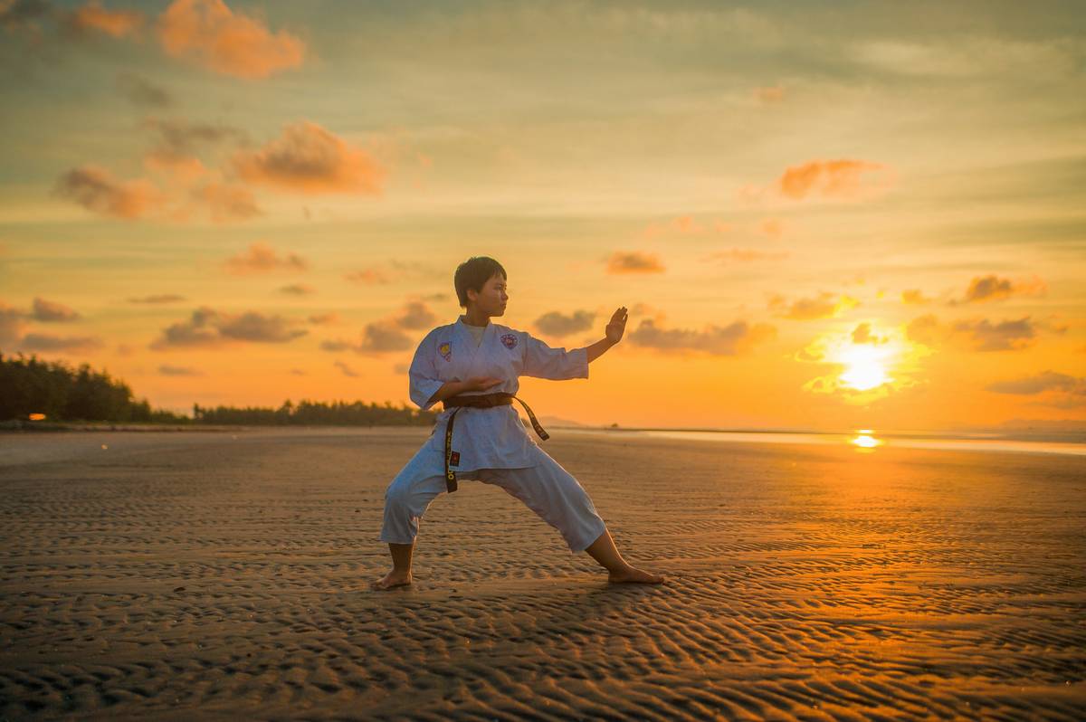 martial arts student meditating at home with focus, mental discipline martial art benefit why